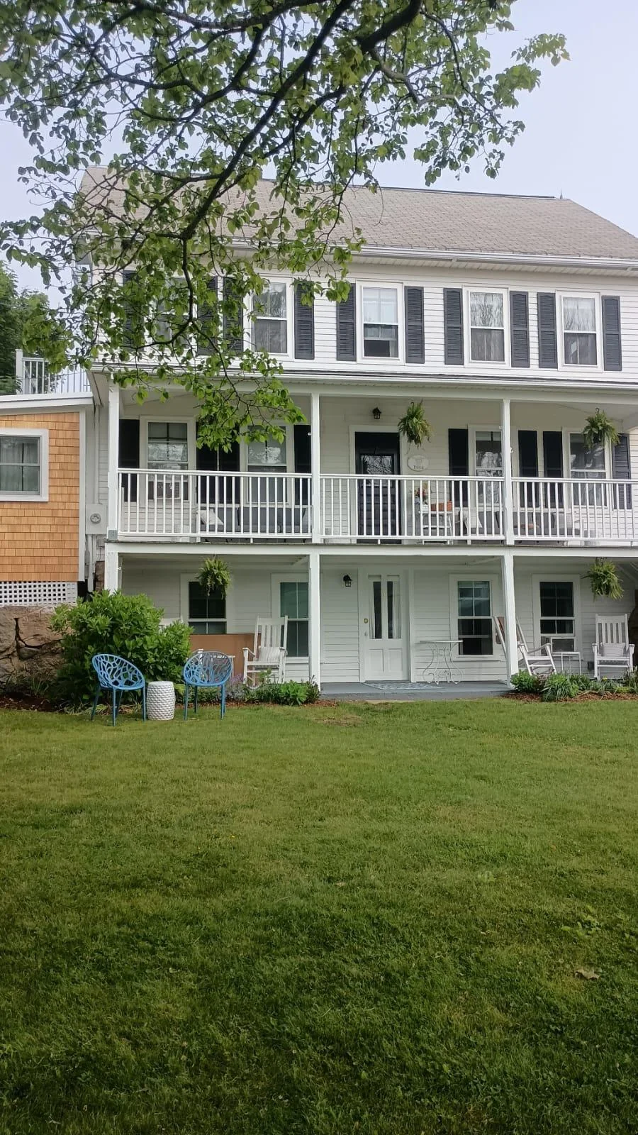 Completed coastal home with exterior decks and porches