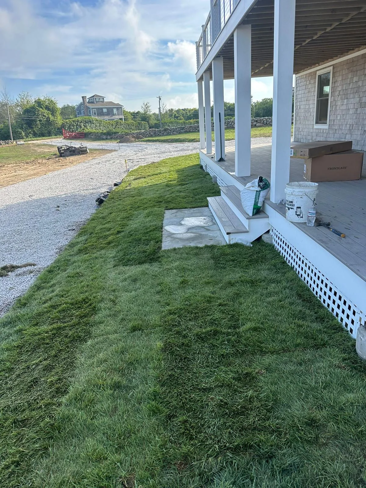Fresh lawn and finished exterior approach