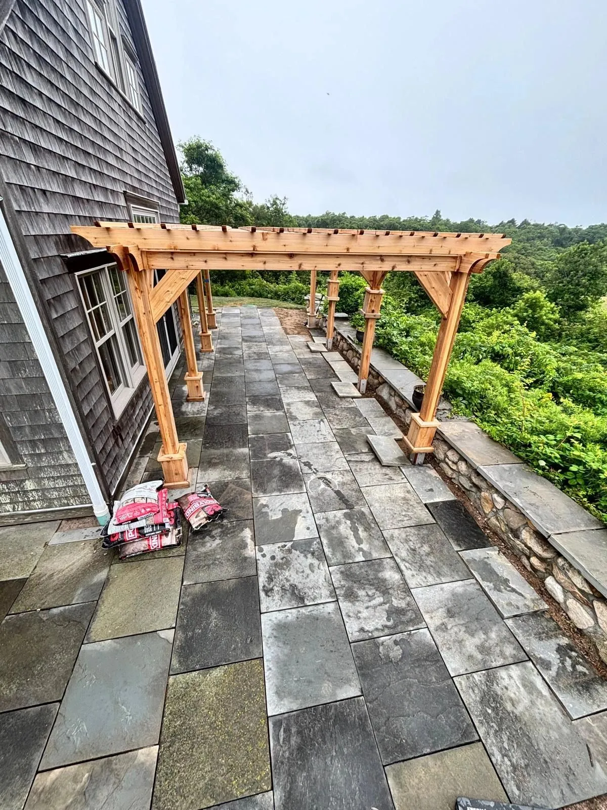 Custom pergola and stone patio